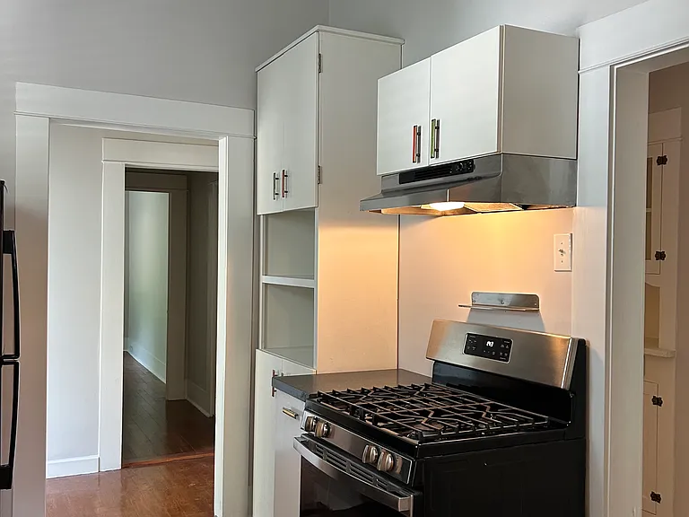 8 x 10 kitchen/ gas range. Connects to the back entry hall and to the left is the swinging door leading back to the living room