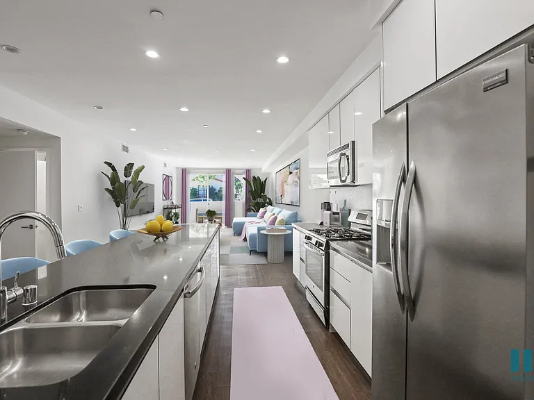 Large-Size Open-Concept Kitchen with Stainless-Steel Appliances and Countertop Bar