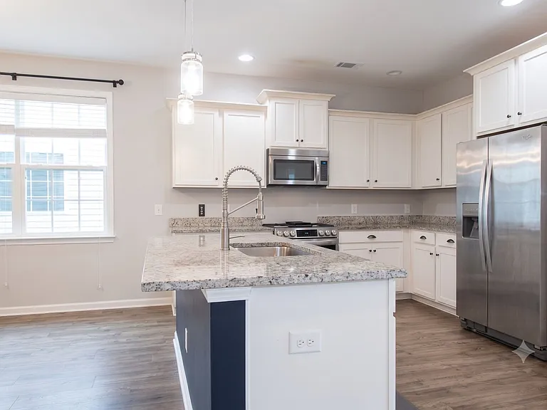 New faucet, garbage disposal, dishwasher, fridge, microwave, gas stove/oven,