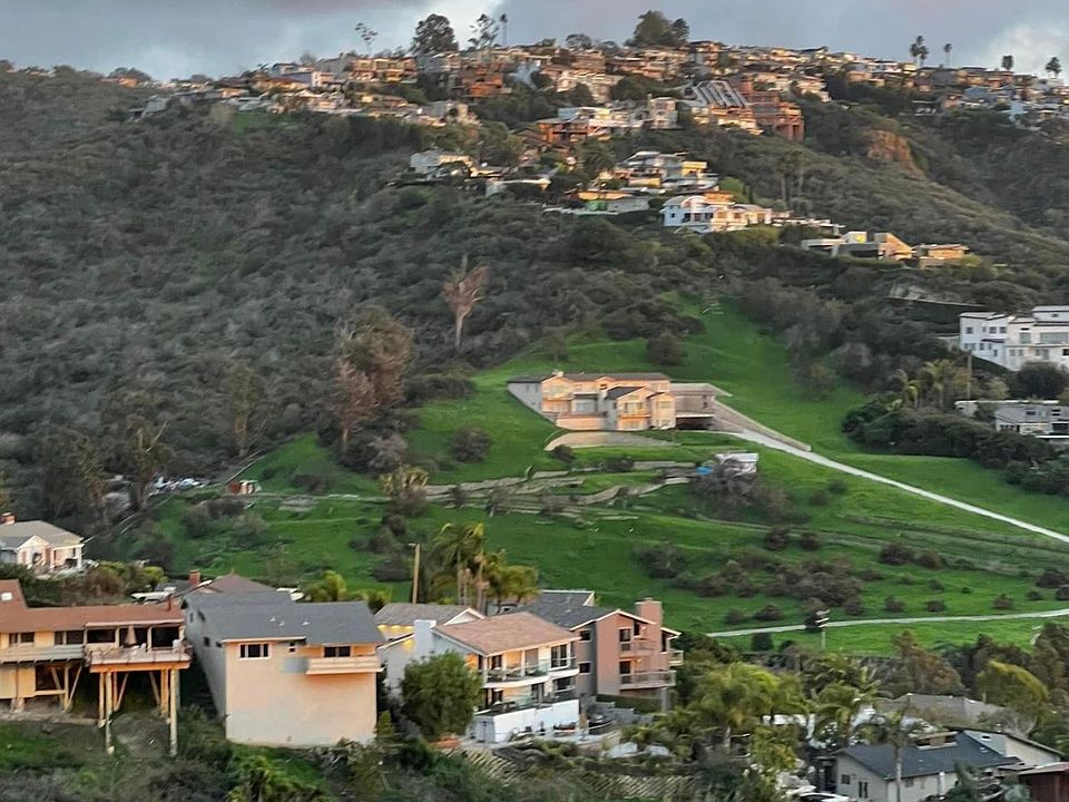 View from the kitchen, living room, and bedroom looking south.