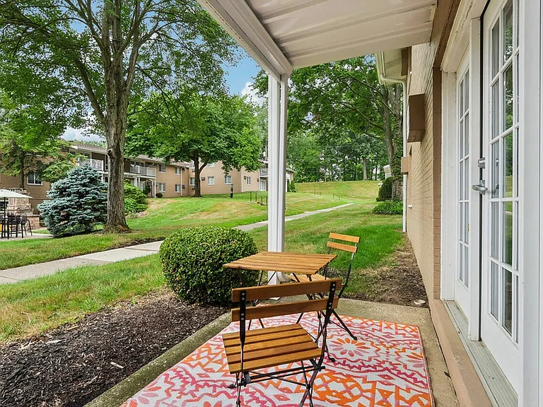 Enjoy the peaceful views from your patio at University Oaks Apartments near Kent State University.