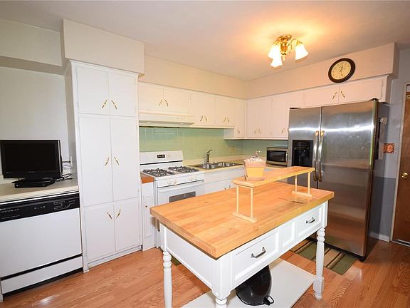 LARGE KITCHEN WITH LOTS OF BRIGHT WHITE CABINETS