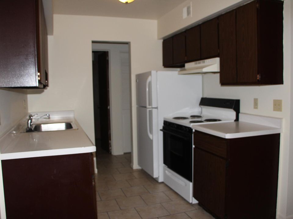 Kitchen, Hall visible past fridge and bathroom door