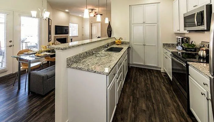 Living room, dining room, and kitchen have Shaw LPV flooring