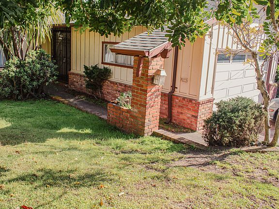 Two-car garage is easily accessed from the house and provides a place to store things, exercise, start you own garage band...