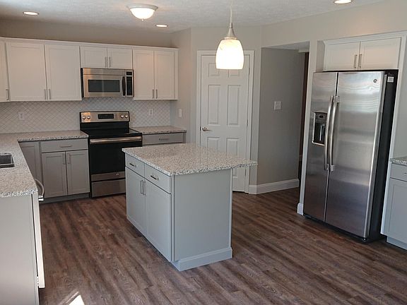 New kitchen cabinets. Grey lowers, White uppers. New Granite counter tops