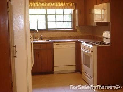 Appliances Included : Kitchen includes new stove and microwave; refrigerator, dishwasher, disposal.