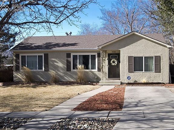 Vinyl windows and extra parking out front.
