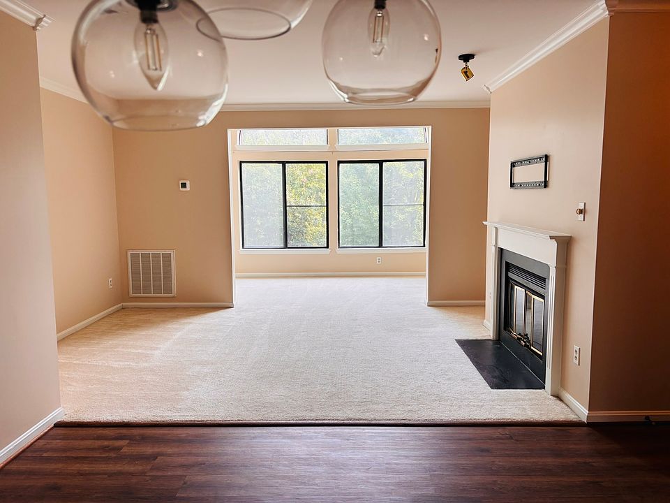 Spacious, bright living area with wood burning fireplace