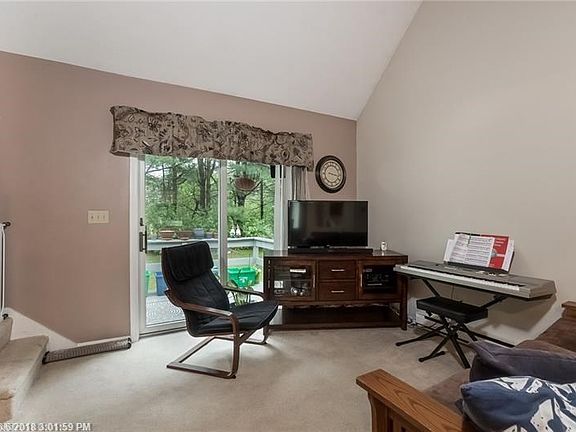 Living room showing the deck accessed by sliding doors.
