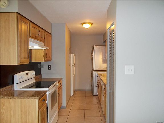 Kitchen with pantry and stack washer/dryer included