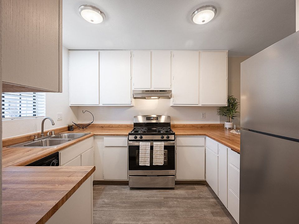 Kitchen with white cabinets and stainless steel appliances