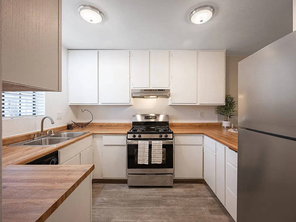 Kitchen with white cabinets and stainless steel appliances