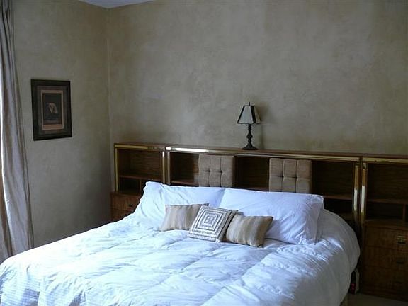 master suite with custom European wall treatment