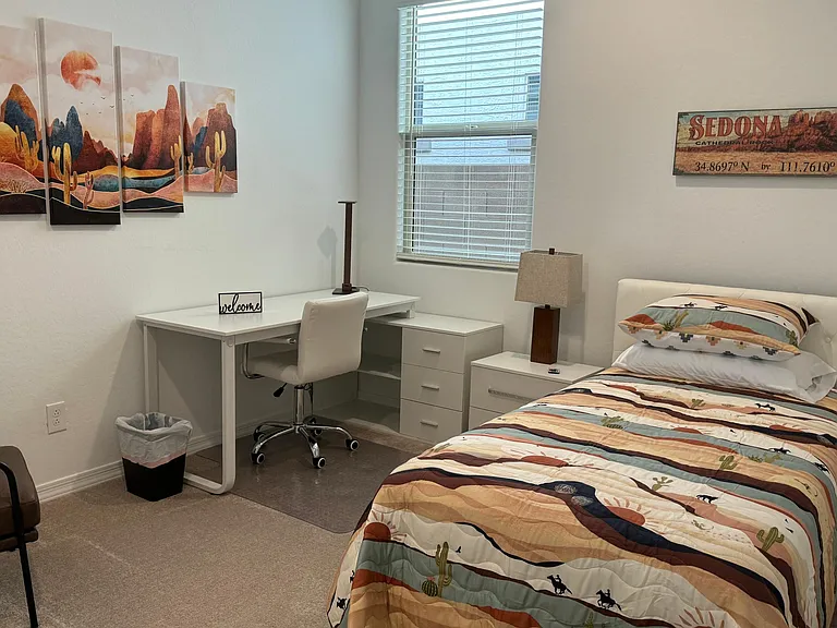 Third bedroom with desk (including drawers and bookshelf. Chair out of view