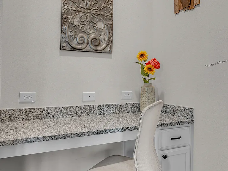 A second workspace is located in an alcove just off the family room. Hardwire for internet is available.