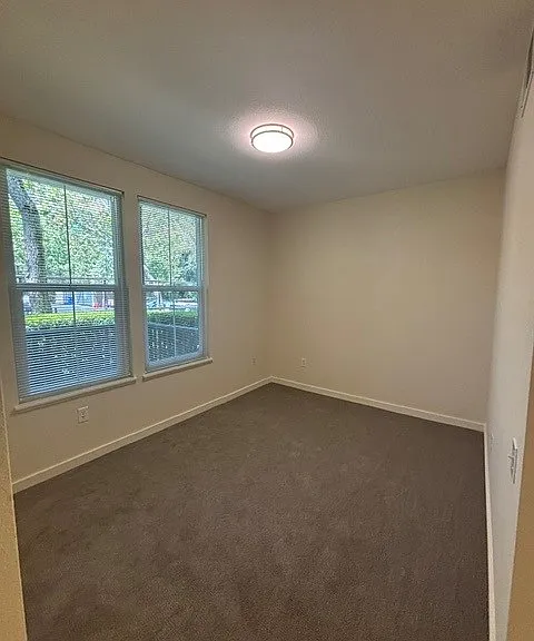 Primary bedroom overlooking porch.