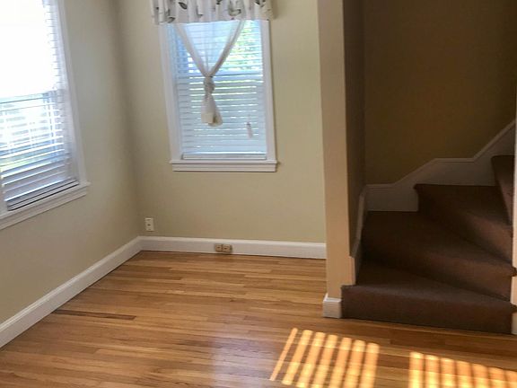 Living room with steps to second floor.
