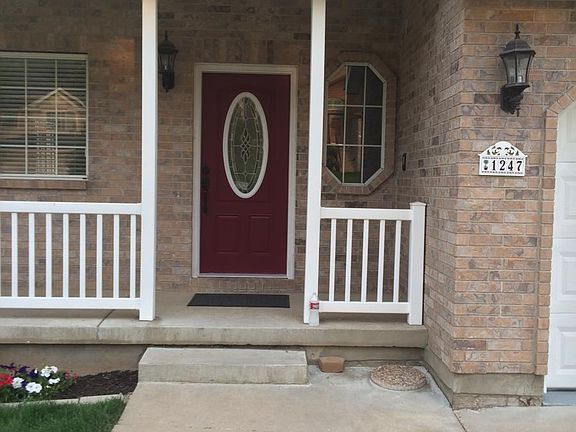Front door, covered porch, vinyl railing