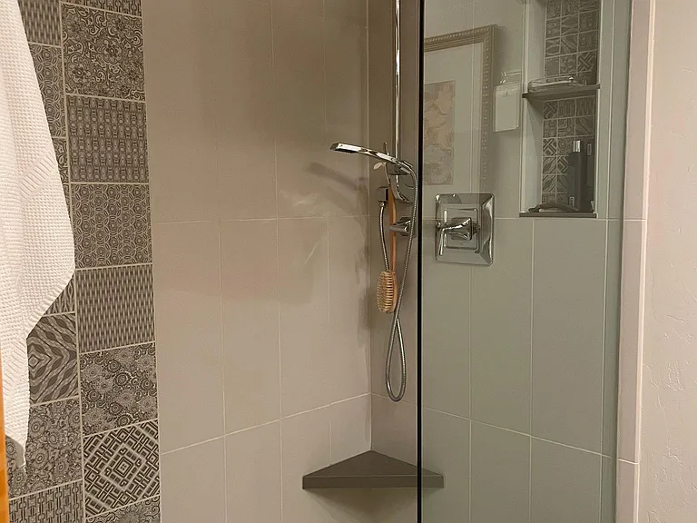 Walk in shower. Heated flooring in this bathroom.
