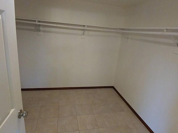 huge walking closet in master bedroom