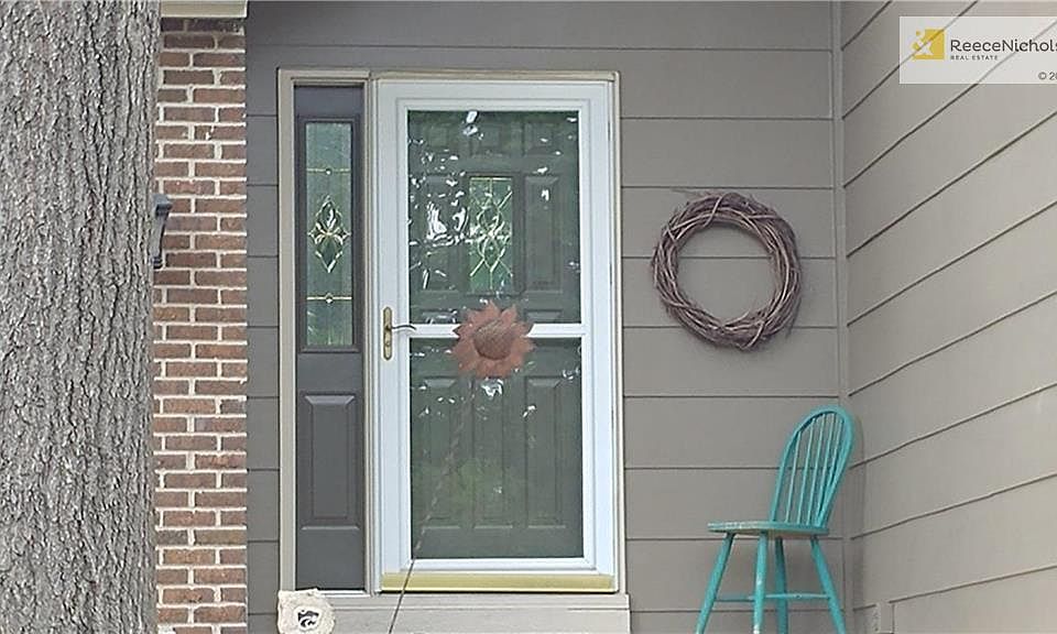 Great entryway with wonderful landscaping.