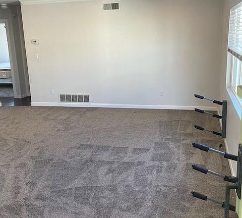 View from the front door. There is a custom longboard rack under the extra large living room window facing west.