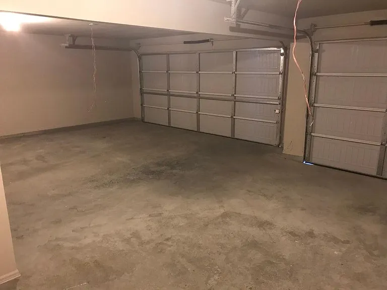 Spacious 3 car garage. Photo for reference.