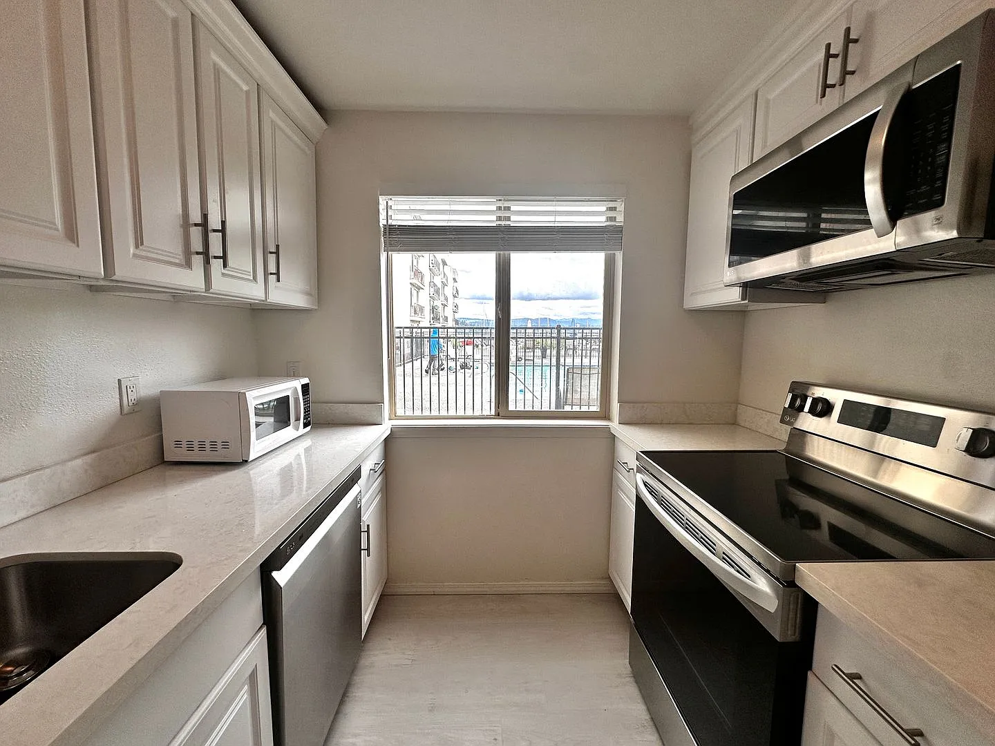 Updated 2-Bedroom Condo with Water Views, 2 Parking Spaces & Poolside Location — Photo 4