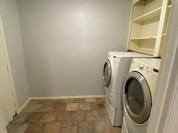 Laundry Room with a connected garage door