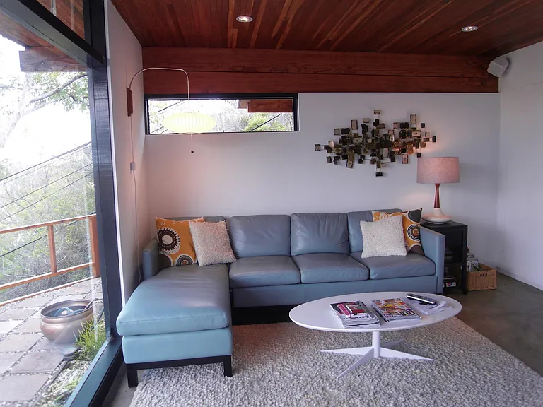 Discover a versatile space that can seamlessly transition from a welcoming guest bedroom to a focused workspace, a relaxed den, or your private fitness area.