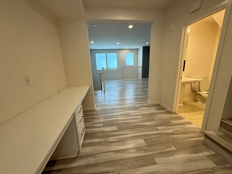 2nd floor: built-in desks/workspace and half bathroom