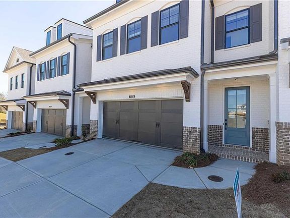 The Stockton plan on lot 3 has a pretty white brick exterior.