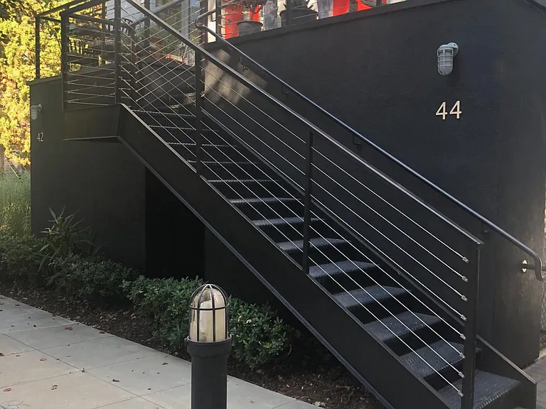 Stairs to the unit from the entry side.