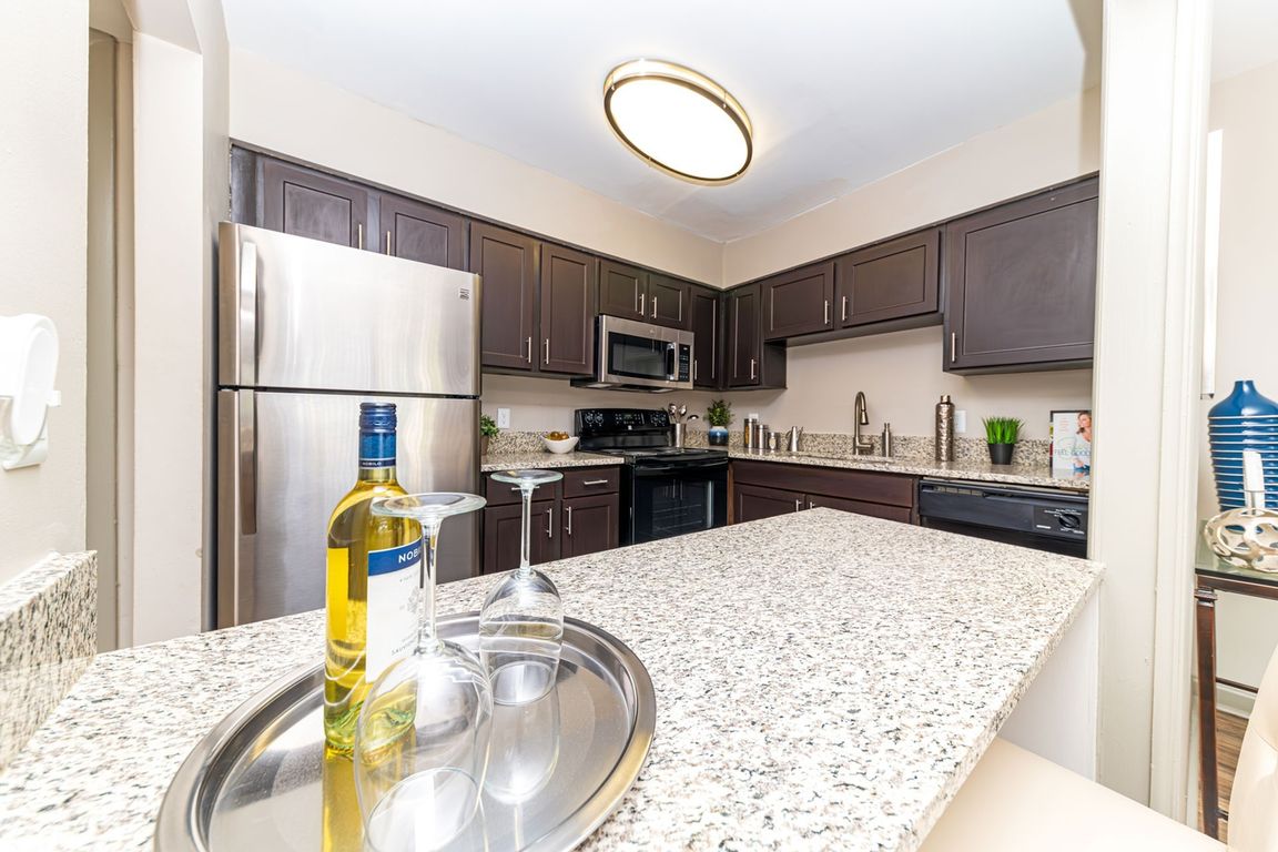 Kitchen area with ample cabinetry & counter space