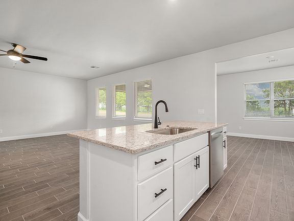 The kitchen looks over in the family room.