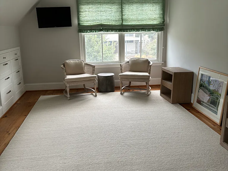 Upstairs master bedroom with 12 built in drawers, four large windows, walk in closet and bath