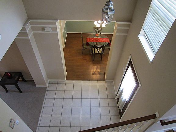 View of open entrance from 2nd floor. Tall ceiling creates grand appeal.