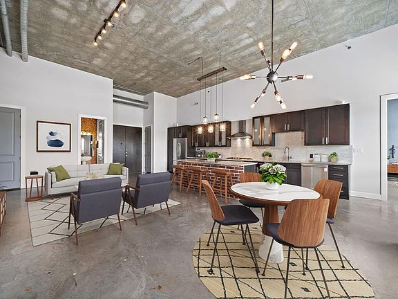 Modern industrial details featured throughout, and flexibility of design and living space. (virtually staged photo)