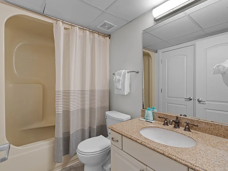 The hallway has a full bathroom for sharing with a tub/shower combo.