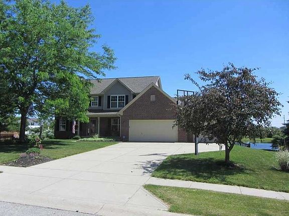 Exterior Front. Covered front porch + 3 Car Garage + Fenced Yard Overlooks Large Pond