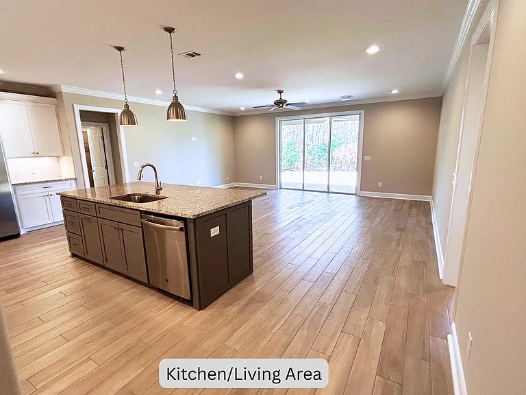 Enter the kitchen and living area from the hall of the front entry