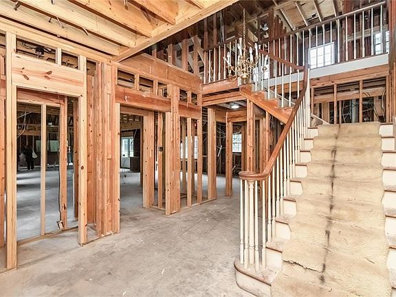 Foyer and staircase to the 2nd floor with coat closet to the left