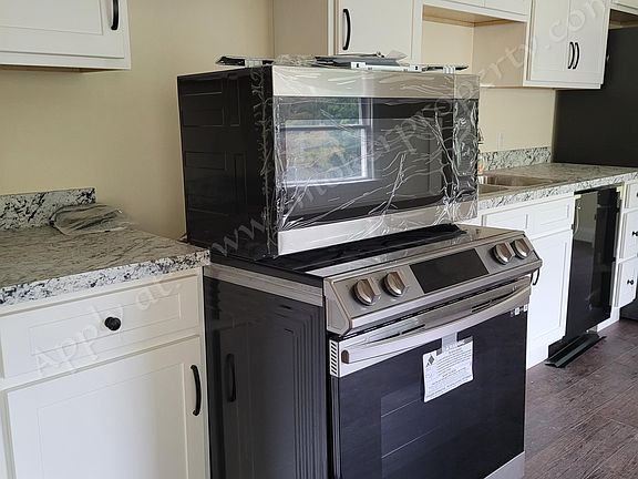 Brand new stove with above stove microwave vent - to be installed