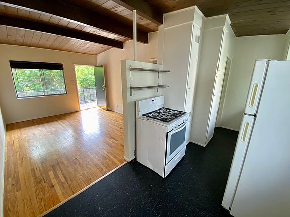View from from dining area into living room and kitchen