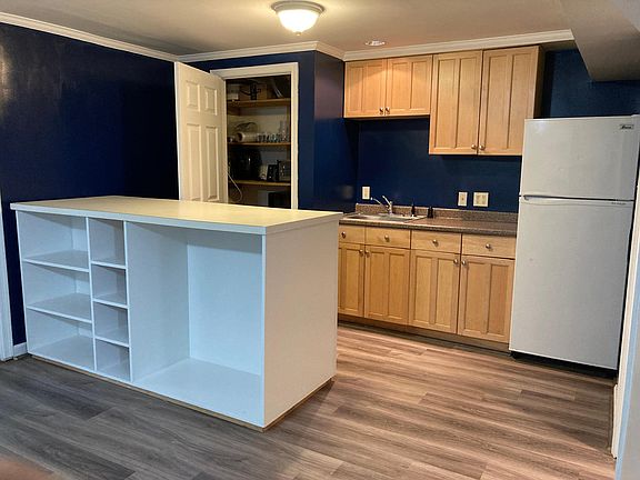 Full fridge and freezer, sink with disposal, counter top appliances welcome!