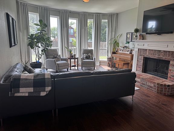 downstairs living room - TV pulls down from the wall. Gas fireplace with added automatic blower.