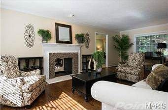 Elegant Living Room with Wood-Burning Fireplace