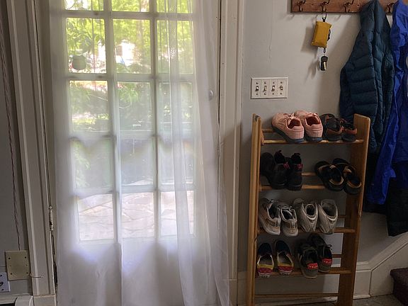Looking out the entry door from the sofa area