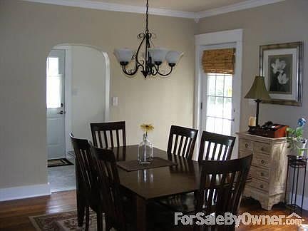 Serene Backyard
						:
						Private backyard with koi pond, huge patio surrounded by white picket fence.